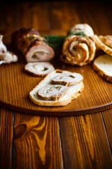 Fototapeta na wymiar Roll of meat with various spices and herbs