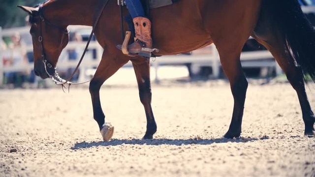Relaxed horse riding in western boots slow mov 4K
