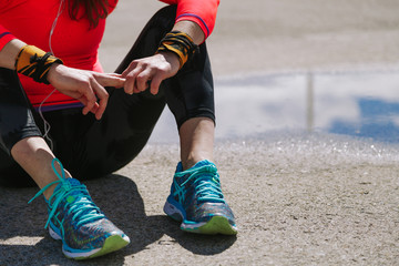 Young woman resiting in the floor after run