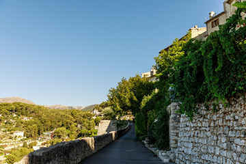 Fototapeta na wymiar hill road with sides covered with vine at old european town, Antibes, France
