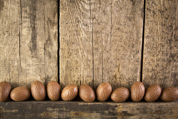 chocolate Easter eggs on wooden background