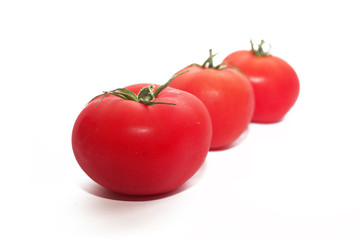 Fresh tomatoes isolated on white. 