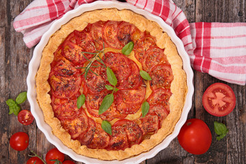 tomato quiche on wood background