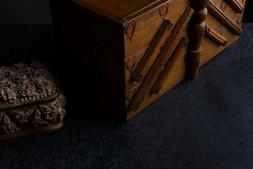 Abstract capture of tailor's old wooden box of sewing materials