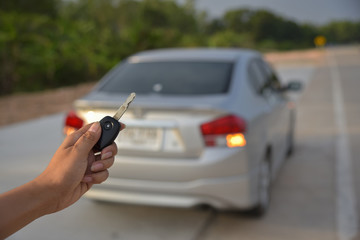 Woman holding a remote control car control.