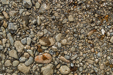 Rock background. Stony soil. Nature background. Ground and stones. Smooth stones. Abstract stone background