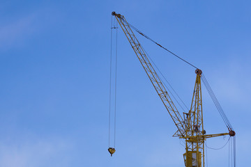 Naklejka premium construction crane on blue sky