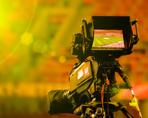LCD display screen on a High Definition TV camera with bright sun and lens flares. Toned