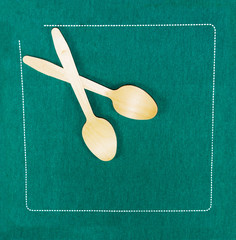 Wood Spoons on a green the napkin - 198613720
