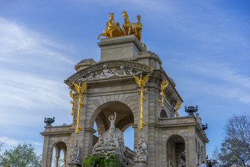 Fototapeta na wymiar Golden horses and gargoyles in the Citadel Park in Barcelona, Catalonia, Spain