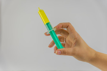 woman's hand with syringe
