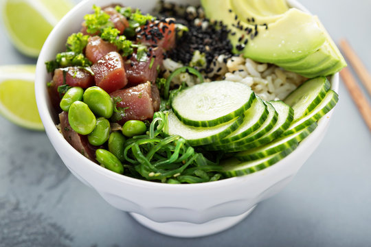 Poke bowl with raw tuna, rice and vegetables