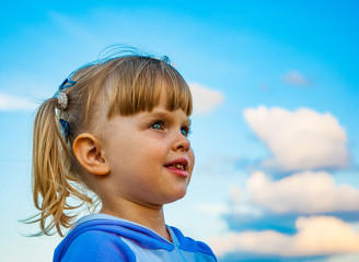 young girl portrait on sky background