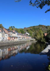 View of the beautiful River Ourthe as it runs through the picturesque town of La Roche en Ardenne in Wallonia, Belgium. With copy space.