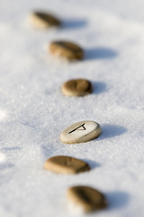 Stone runes on the snow