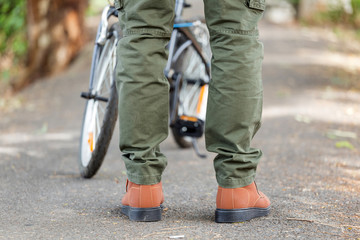 Man wearing cargo pants standing in the nature park