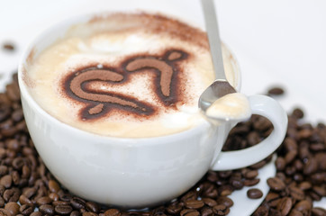 Good Morning: Close up white coffee cup on wood tab / Cup of latte art coffee with coffee beans :)