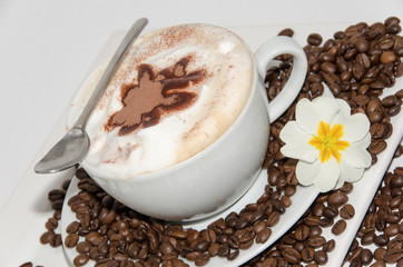 Good Morning: Cup of latte art coffee with coffee beans :)