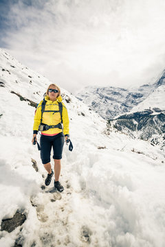 Woman hiker walking in Himalaya Mountains, Nepal