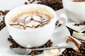 Good Morning: Cup of latte art coffee with coffee beans :)