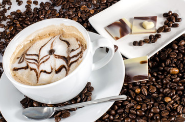 Good Morning: Cup of latte art coffee with coffee beans :)
