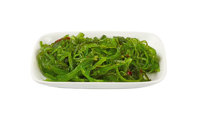 Close up portion of green wakame seaweed salad