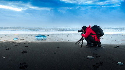 Photographer take a photo at ice in Iceland.