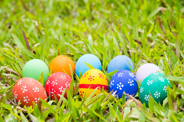 Painted Easter eggs put on the straw in the grass,easter day