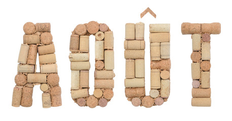 Word August in French Août made of wine corks isolated on white