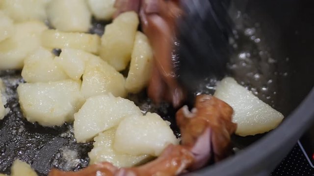 Sausages And Potato On A Frying Pan