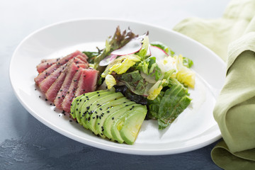 Tuna salad with sliced avocado