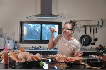 Women preparing buns at table in bakery
