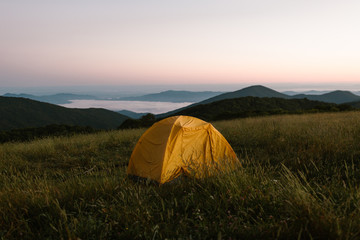 Tent Camping on Top of a Mountain At Dawn