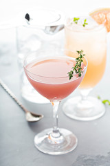 Variety of citrus cocktails on gray surface