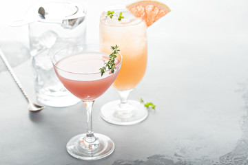 Variety of citrus cocktails on gray surface