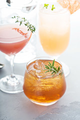 Variety of citrus cocktails on gray surface
