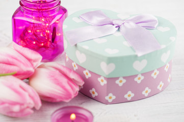 Gift box as heart and tulips