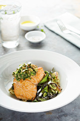 Grilled salmon on the bed of sauteed greens