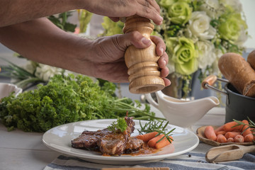 lamb steak on white plate