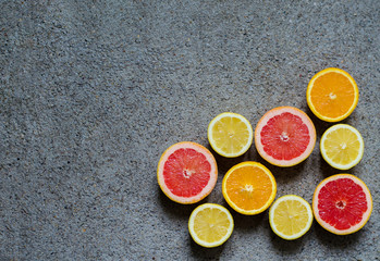 Tropical citrus fruits halves top view