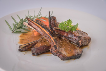 lamb steak on white plate