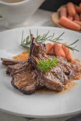 lamb steak on white plate