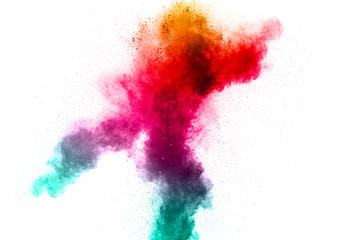 Abstract multi color powder explosion on white background.  Freeze motion of color dust  particles splash. Painted Holi