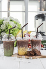 chocolate milk arranged on wood table