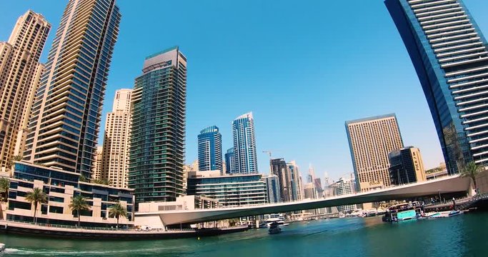 DUBAI, UNITED ARAB EMIRATES, MARCH 22 2018: Dubai Marina Architecture Time Lapse. 
Dubai Marina Boat Ride Timelapse with Beautiful Architecture