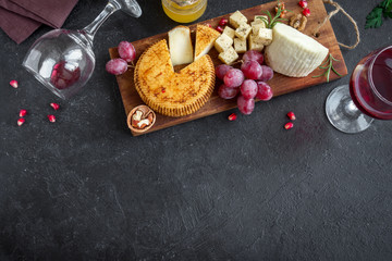 Fototapeta na wymiar Cheese, fruit platter and wine