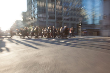 People in motion in generic urban background