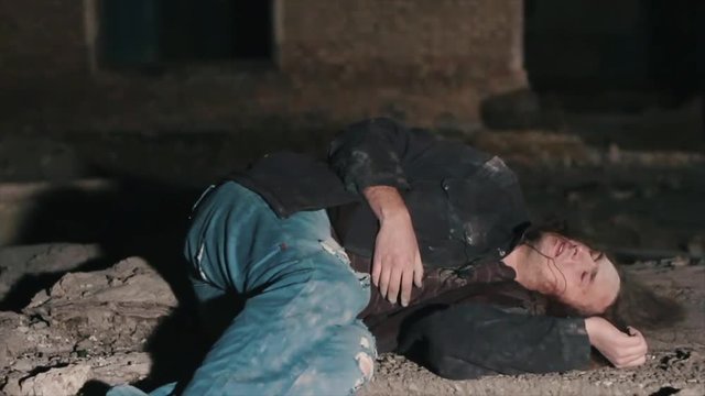 Exhausted man falls to the ground and hits his head. A homeless man in poor condition