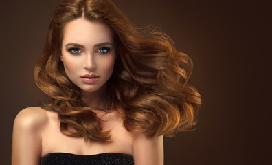 Beautiful model girl with long red curly hair .Red head . Care and beauty hair products  - 198639368
