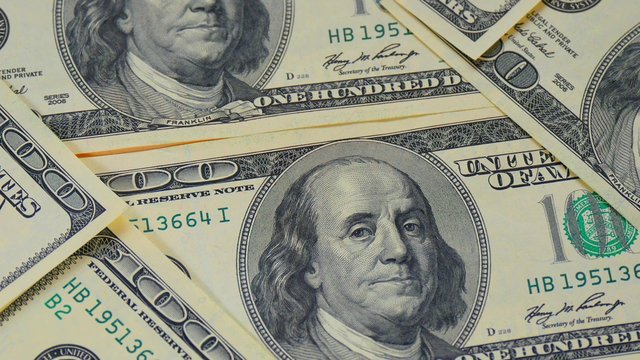 Hundred-dollar bills close-up, motion slider - 229. Macro photography of banknotes. Portrait of Benjamin Franklin.
